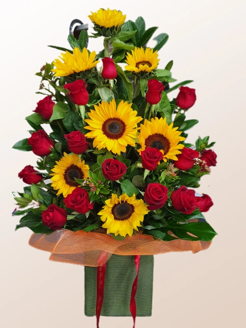 Summer love, A large arrangement of sunflowers and red roses.