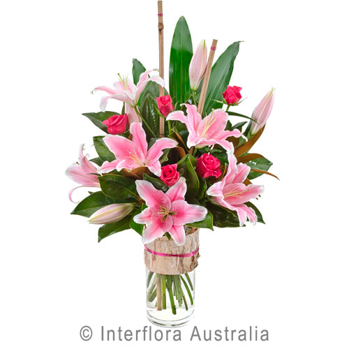 Allegra, Modern Bouquet of Oriental Lilies and Roses in a Glass Vase.