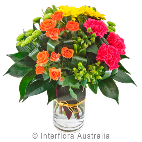 Sassy, Bright Grouped Bouquet in a Glass Vase.
