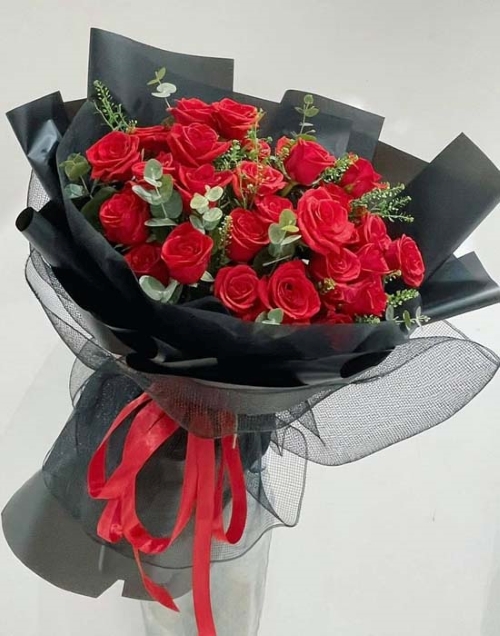 Adore, A bouquet of roses in an arrangement.