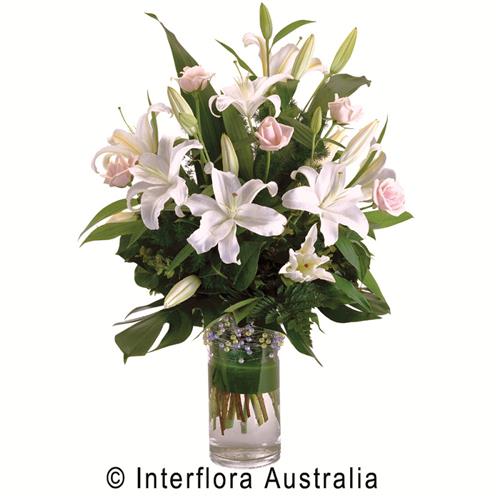 Prudence, Modern Bouquet of Oriental Lilies &amp; Roses in a Glass Vase.